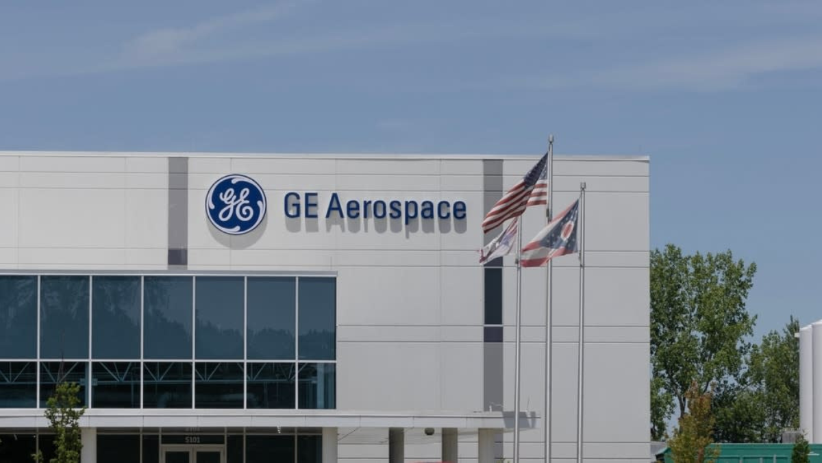 GE Aerospace building exterior with US and state flags in front of facility
