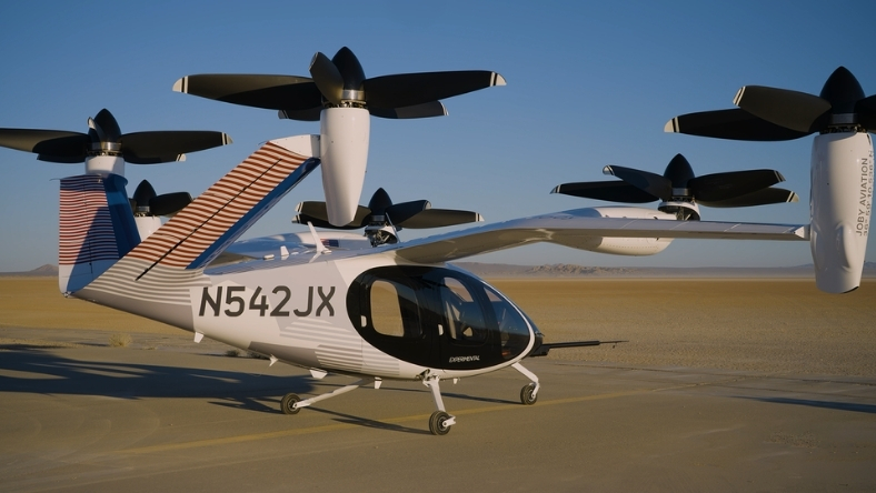 Electric vertical takeoff aircraft parked on a runway