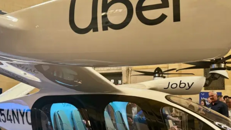 Joby eVTOL aircraft featuring Uber logo on display